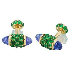 For the connoisseur who appreciates only the finest, and most unique, cufflinks. Vivid green tsavorite garnets are paired with custom cut bullet shaped tanzanites in a one of a kind yellow gold mounting. You will never see another pair like this and they are destined to become a family heirloom. Complimentary overnight delivery and the finest Italian suede and leather gift packaging is always included. Described by Departures Magazine as, "being a hit with men searching for cufflinks that are ne Luxury Vintage Cufflinks For Formal Wear, Luxury 14k Gold Hallmarked Cufflinks, Emerald Cufflinks, Unique Cufflinks, Luxury Classic Collectible Cufflinks, Vintage Collectible Cufflinks, Diamond Cufflink, Luxury Vintage Collectible Cufflinks, Heritage Jewellery