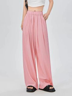 Discover effortless style with our Elastic Waist Pleated Trousers with Pockets – your new go-to for laid-back sophistication. 

Made with a luxurious blend of materials, these high-waisted trousers offer a loose fit that drapes beautifully for a relaxed silhouette. The pleated design and subtle pockets combine functionality with a touch of casual elegance, making them perfect for a seamless transition from office to evening. 

Pair these versatile trousers with a fitted blouse and heels for a pr Pleated Trousers, Casual Tee, High Waisted Trousers, Casual Elegance, Crop Top, Easy Wear, Warm Weather, Bottoms Pants, Effortless Style