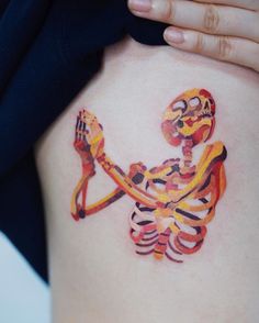 a person with a tattoo on their stomach