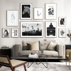 a living room filled with furniture and framed pictures on the wall above it's coffee table