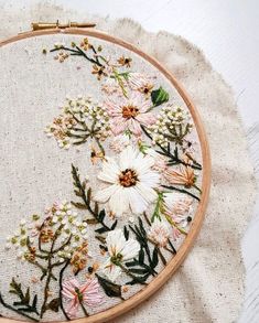 the embroidery is being worked on by someone who has just finished this project and it's done