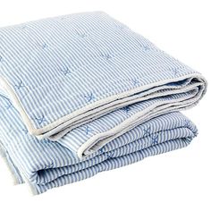 a blue and white striped blanket folded on top of each other