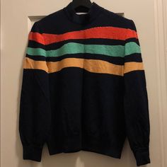 Brand New, Never Worn, No Tags. Vintage St. John Pullover Knit Sweater With Mock Neck Detail And Colorful Stripes. Zips At Shoulder / Neck. Dark Navy Blue Body With Vibrant Orange Green And Yellow Stripes. Clear Little Rectangles Lining The Stripes Which Add A Subtle Shine Detail When It Catches The Light. Super Retro Grandpa / Grandma Style. Reminds Me Of What Aunt Viv Would Wear On Fresh Prince Of Bel-Air. High Quality Knit Material. Banding Around Neck And At Sleeve Cuffs. Made In The Usa. Si Blue Funnel Neck Sweater For Layering, Blue Knit High Neck Sweater, Blue Sweater With Ribbed Collar For Layering, Casual Blue High Neck Sweater, Casual Multicolor Fine Knit Sweater, Blue Turtleneck Sweater For Layering, Multicolor Fine Knit Casual Sweater, Blue High Neck Sweater For Fall, Multicolor Fine Knit Sweater For Winter