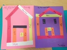 three different colored paper houses on top of each other with numbers cut out from them