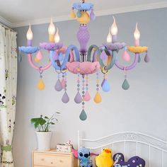 a chandelier hanging from the ceiling in a child's room