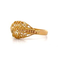 This exquisite modern filigree ring, crafted from 21 karat yellow gold, features an intricate design that highlights its rich, vibrant hue. The detailed filigree work is meticulously fashioned into delicate swirls and curves, creating a lace-like effect that captures and reflects light beautifully. This unique piece stands out whether worn alone or paired with other pieces, adding an artistic and sophisticated look to any ensemble. Filigree Ring Gold, Platinum Rose Gold, Sapphire Solitaire, Gold Filigree, Filigree Ring, Shop Engagement Rings, Intricate Design, Cocktail Ring, Cocktail Rings