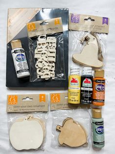 some craft supplies are laid out on a table together, including glue, paper and scissors