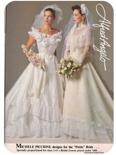 two women in wedding gowns standing next to each other