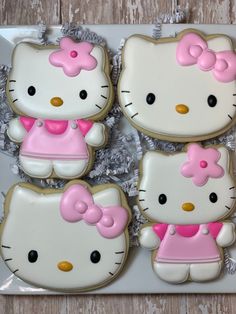 hello kitty cookies are arranged on a plate