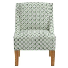 a green and white patterned chair with wooden legs