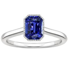 Sparkling Sapphire Radiant Cut Gold Ring METAL SPECIFICATIONS White Gold 14K STONE SPECIFICATIONS Stone Name : Blue Sapphire Stone Cut : Radiant Stone Details : There is one radiant cut sapphire approx. 3 carats (Approx. Size 9 x 5 mm) and approx. 0.25 carats of diamonds on the sides. Natural earth mined stones. Color : F Quality : VS1 Quality of Sapphire : AAA Total : Approx. 3.25 Carats RING SPECIFICATIONS Size : 6.5 (Can ship in any size, please send us a message about size after placing the 3 Carat Ring, Radiant Cut Rings, Blue Sapphire Stone, Ring Bezel, Blue Sapphire Ring, Blue Sapphire Rings, Radiant Cut, Sapphire Stone, Natural Earth