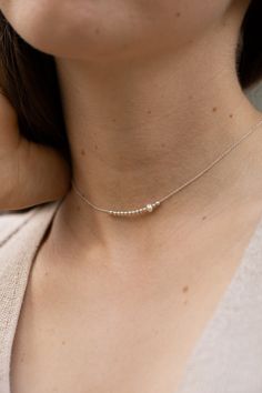 This dainty choker is hand-made of 925 sterling silver beads and a single freshwater pearl. The necklace is a perfect everyday jewelry piece. Length:   ● 35 cm with a 5 cm extension  Lengths are measured from end to end, the clasp is included in the measurements. The choker will include an additional 3 cm extension chain. Want to see more jewelry from my shop? click here: http://etsy.me/2uPuv0x ● The item will be shipped beautifully wrapped, as shown on the last picture of the listing, and ready Sterling Silver Choker, Dainty Choker, Silver Choker, Chain Choker Necklace, Chain Choker, Minimalist Necklace, Delicate Necklace, Everyday Jewelry, Sterling Silver Bead