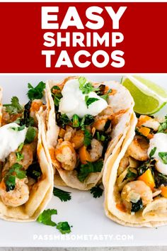 easy shrimp tacos on a white plate with lime wedges