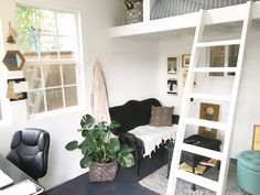 there is a loft bed with a ladder to the top and a couch below it