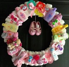 a wreath made out of baby shoes and other items