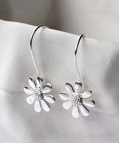 The Sterling Silver Sunflower Hook Earrings are a charming and delightful piece of jewelry that captures the beauty of nature. These earrings feature a sunflower design that is made with high-quality sterling silver. The sunflower design is intricately crafted to create a realistic and detailed look that captures the essence of the flower. The earrings are designed with a hook closure that allows for easy wear and removal. The Sterling Silver Sunflower Hook Earrings are lightweight and comfortab Daisy Pendant, Elephant Earrings, Wedding Earrings Drop, Wedding Party Jewelry, Daisy Earrings, Flower Accessories, Trendy Earrings, Design Minimalista, Metal Earrings