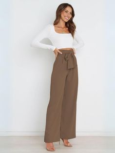 Add some flair to your wardrobe with our Iconic High Rise Pocketed Trouser Pants in classic khaki. Featuring a chic bow-tie belt, these pants are perfect for any stylish occasion. Stay comfortable all day long with the high rise fit and functional pockets. Upgrade your look with a touch of playful sophistication! Size Guide: Model is 5’6” tall, and has a 32.2” bust, 26.2” waist, & 34.8” hips. She is wearing a S / US 4 / AU 8. This pants is true to size. Material: 100% Polyester . Feature: Side Pockets. High rise. Straight leg. Front zip fly. Adjustable Bow-Tie Belt. Not Lined. Care Instructions: Machine wash / Cold hand wash Workwear Women, Fashion Workwear, Dress Pant Suit, Dress Work, Loose Fabric, Work Style, Work Wear Women, Wool Blend Coat, Matches Fashion