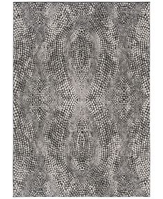 a black and white rug with circles on it