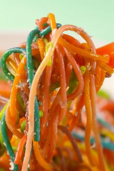 a close up view of carrots and noodles