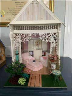 a doll house with furniture and accessories in it