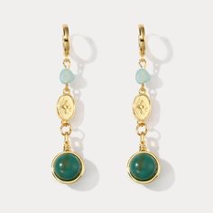 These exquisite Green Gemstone Earrings will add a touch of luxury and refinement to your look. Crafted from carefully selected gemstones, they feature a unique design that blends classic beauty and modern elegance. Perfect for special occasions or everyday glamour, these earrings are sure to be treasured. DETAILS Plating: 18K Gold Materials: 18K Gold on Brass, Cubic Zirconia, Gemstone Size: 1.77"*0.67"(45mm*17mm) Weight: 3.06g/pr Dainty Dangle Earrings With Natural Stones, Dainty Natural Stone Dangle Earrings, Elegant Green Natural Stone Hoop Earrings, Elegant Gemstone Hoop Earrings In Gold Plated, Dainty Natural Stone Drop Earrings, Elegant Gold-plated Gemstone Hoop Earrings, Elegant Gemstone Danglers, Gold Linear Earrings With Gemstone, Gold Gemstone Drop Danglers