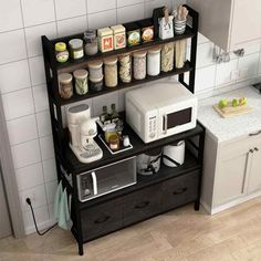 a kitchen with a microwave, coffee maker and other items on the counter top in front of it