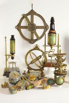 an assortment of antique items displayed against a white background