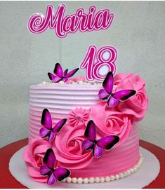 a birthday cake with pink frosting and purple butterflies on top that says marina 48