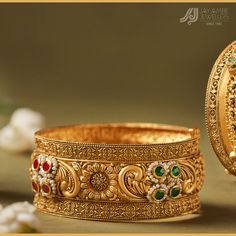 As distinct as the spark of alluring colour. As rooted as the timelessness of fine gold. This antique kada bangle is crafted with the tradition of yesteryear infused with the brilliance of today.  Visit our store to explore more about #advaitbride  #advaitbyjayambejewellers   DM us to explore our collection. Whatsapp: +91 75748 54248 • • • #heritage #BridalJewelry  #Antique #GoldJewelry #AntiqueJewelry #VintageJewelry #bridaljewellery #DiamondJewelry #Solitaire #Diamond #polki #polkijewellery #templejewellery  #JewelryMaking #JewelryDesigner #jewelrydesign #jewellery #heritagejewellery #jadaujewellery  #preciousjewels #indianjewelry #Valsad #indianbride #advaitbride Antique Gold Bangle, Jay Ambe, Gold Bangles For Women, Polki Jewellery, Precious Jewels, The Spark, Solitaire Diamond, Gold Bangle