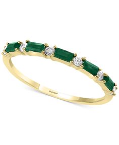 a yellow gold ring with emerald and diamonds