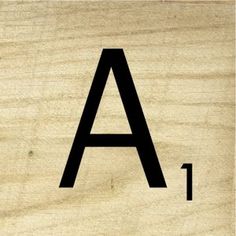 a wooden block with the letter a in it's lowercase and lowercase