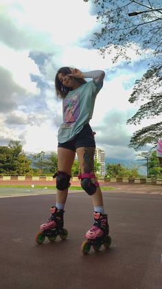 a woman riding roller skates on top of a parking lot