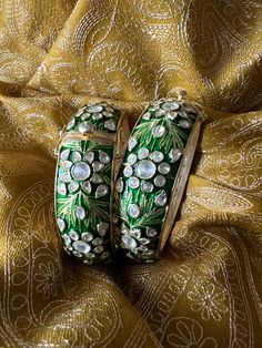 A fine pair of Enamelled Kadas with beautiful design.  Metal Purity: 92.5% Pure Silver Size: 2.25 inches Inner Diameter. Openable, Extra Support Clip. Recommended for wrist sizes of 2.4 Set of Two (2) The weight of the Kadas is 178 grams for the pair. Elephant Bangle, Wedding Jewelery, Engraved Bangle, Stone Necklace Set, Indian Necklace, Heirlooms Jewelry, Vintage Bangles, Silver Necklace Statement, Handmade Bangles