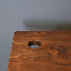 a wooden table with a hole in the middle