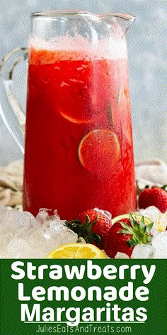 strawberry lemonade margarita with limes and strawberries on the side, in a pitcher