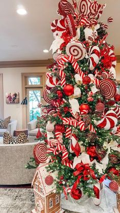 a christmas tree decorated with red and white candy canes