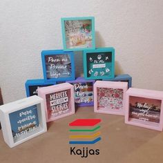 there are five different colored frames on the table and one is for children's pictures