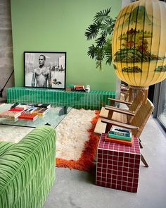 a living room filled with furniture and a large balloon above the coffee table in front of it