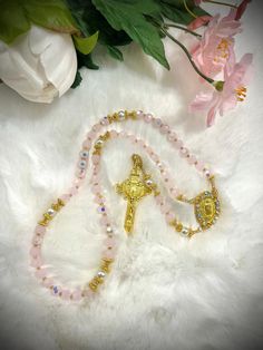 WELCOME TO OUR SHOP  This is a handmade Gorgeous rosary made from gorgeous pink and white petals. Finished with gold medal & crucifix! Made with the highest quality materials and glass beads. Thoughtfully designed and carefully made with the finest, high quality materials.  We can make any rosary you wish, just send us a photo and we can complete the job for you! Custom orders with personalized names, adding pictures and bulk orders are AVAILABLE :) We have variety of beads color selections and Handmade Pink Rosary For First Communion, Handmade Pink Rosary For Baptism, Pink Spiritual Jewelry For First Communion, Handmade Pink Jewelry For Baptism, Wedding Communion, Handmade Rosary, Custom Rosary, White Petals, Catholic Gifts