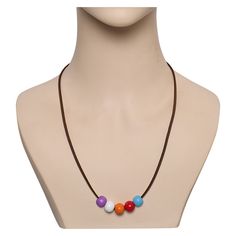 a necklace with multicolored beads on a mannequin's neckline