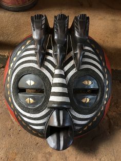 This Hand carved African wood masks will bring a piece of art into your home. Our Masks are carved by talented craftsmen in Ghana and other neighboring Countries. The beautiful mask is covered with richly textured African beads . This wood mask will brighten up your home and office spaces with its authenticity. Measurements: Height: 20 inches Width: 20 inches Note: Handcrafted item- color, size may slightly very. Kindly check our store for unique and authentic African wooden masks. Send us a mes Wooden Masks Carved Wood, Wooden Masks, History Exhibition, Owl Mask, Hand Fans For Wedding, Wooden Mask, Mask Pictures, Wood Mask, Mask Aesthetic