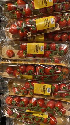 tomatoes are wrapped in plastic and ready to be sold at the grocery store for sale