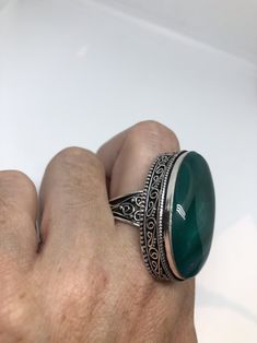 Large green agate Ornate German Silver Vintage ring, does not tarnish Size 9 can be re sized, my jeweler charges a $10 - $15 fee All rings are shipped in a nice gift box. Check out our over a THOUSAND great reviews Engraving is $4 per letter and is not always perfect depending on the piece. It can take a few days if the jeweler is busy. This is payable to Paypal Judithsltd@gmail.com Green Ring With Large Stone, Green Oval Crystal Ring With Natural Stones, Green Rings With Natural Stones, Green Natural Stones Ring, Green Jewelry With Large Round Stone, Nickel-free Green Agate Jewelry, Green Crystal Ring With Natural Stones, Spiritual Green Ring With Large Stone, Spiritual Green Open Ring