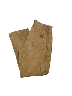 Vintage 90s Dickies Canvas Workwear Carpenter Pants Size 36 Beige MEASUREMENTS Size is based off measurements not the tagged size. Please refer to measurements. SIZE - 36 WAIST FLAT - 18" (measurement is multiplied by 2 to get the size) RISE - 15" INSEAM - 32" LEG OPENING - 9" Please note that due to the nature of pre-owned clothing; the size mentioned in the title may not be an accurate representation of the item's fit in accordance with modern sizing guides. Referring to the measurements will Vintage High Waist Cargo Pants For Streetwear, 90s Style Full-length Pants With Side Pockets, 90s Full-length Pants With Side Pockets, Retro High Waist Cotton Cargo Pants, Retro High-waist Cotton Cargo Pants, 90s Cotton Cargo Pants, 90s Cotton Pants With Side Pockets, 90s Style Cotton Pants With Side Pockets, 90s Wide Leg Pants With Belt Loops