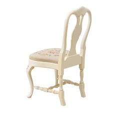 a white wooden chair with floral upholstered seat and back cushion on an isolated white background