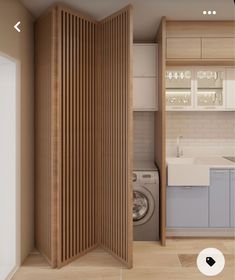 a room divider in the middle of a kitchen with washer and dryer