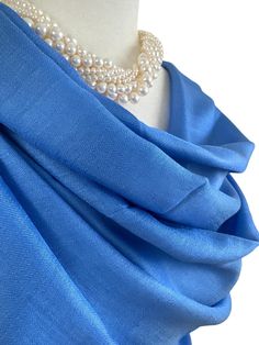 This is an all season shawl. This versatile shawl can be used to dress up an outfit for a special evening, a wedding or as a neck scarf in the winter. Easy to carry anywhere, perfect for when you need it at a restaurant or at the office in air conditioning or a cool summer evening. Effortlessly give a dress a new look by simply adding this shawl. A must have when you travel! COLOR MATCHING/ACURACY The color is very close however is not exact, I tried to to capture the colour as acurately as poss Elegant Formal Pashmina Shawl Traditional Drape, Elegant Blue Scarves For Wedding, Elegant Blue Scarf For Wedding, Pashmina Shawl Gift, Pashmina Shawl For Gift, Pashmina Silk Scarf For Wedding With Traditional Drape, Silk Pashmina Shawl For Wedding, Elegant Blue Pashmina Shawl, Elegant Pashmina Shawl As Gift