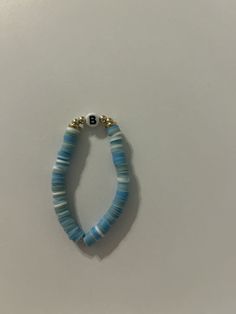 the beaded bracelet is on display against a white background