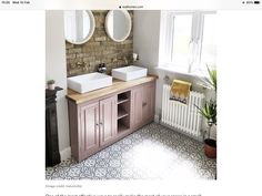 an image of a bathroom setting with two sinks and mirrors on the wall above it