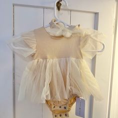 Reverie Threads Donna Dress (Size 80 Or 12-18m). Ordered Multiple Sizes To Get Best Fits, Never Worn. Tags Attached With Matching Bow Spring Bubble Romper With Puff Sleeves And Ruffles, Fitted Cream Bubble Romper With Ruffles, Cream Fitted Bubble Romper With Ruffles, Cute Beige Bubble Romper With Ruffles, Cute Cream Puff Sleeve Dresses, Cute Beige Ruffled Bubble Romper, Cream Bubble Romper With Ruffles For Baptism, White Flutter Sleeve Bubble Romper For Spring, Cream Ruffled Bubble Romper For Baptism